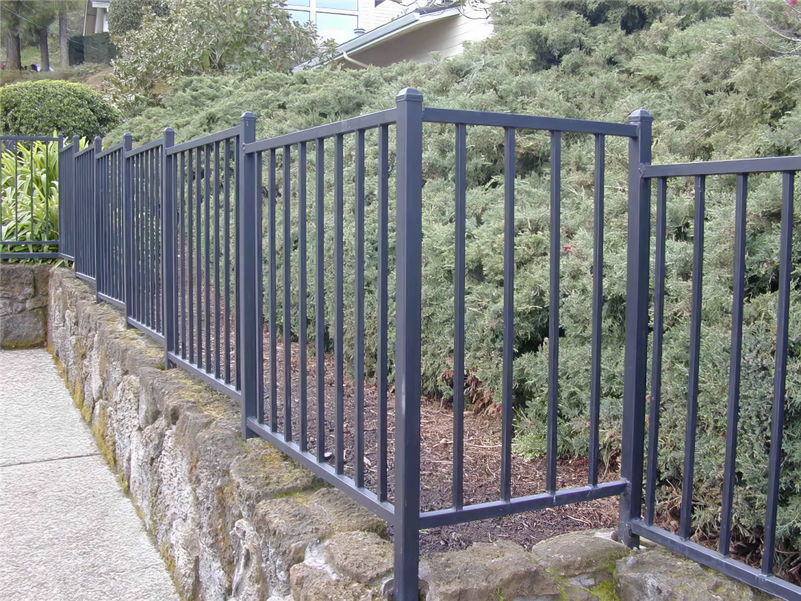Metal Pool Fence on Stone Wall